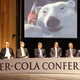 Representatives from alternative colas discuss their ad platform, above; a public RC Cola display, right.